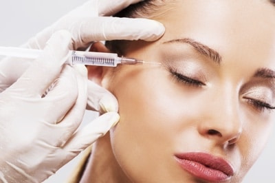 Close up of woman receiving beauty treatment with Botox.