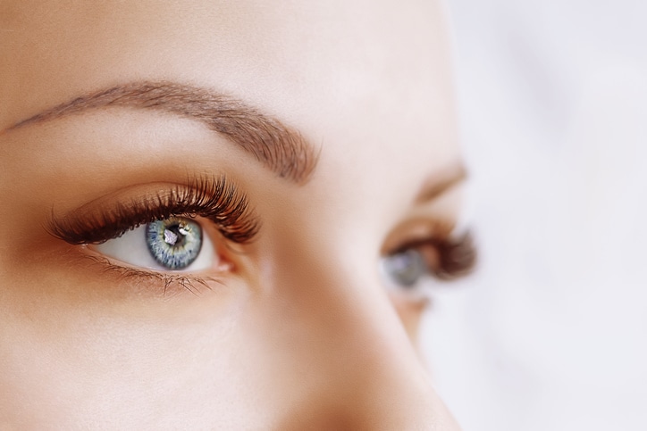 close up picture of woman's eyes with white background
