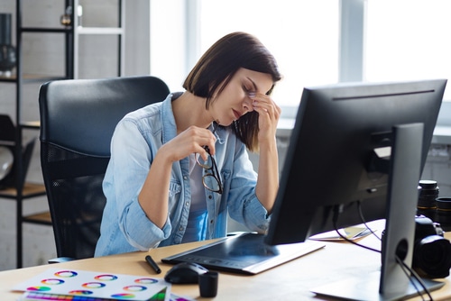 Stressed worker have eye strain symptoms