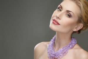 Middle aged woman has youthful jaw and neck contours with aminimally invasive treatment