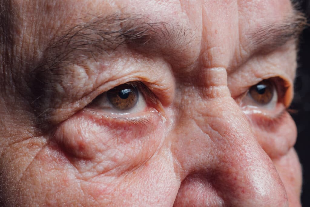 Seniors eyes close up, contemplative old caucasian woman
