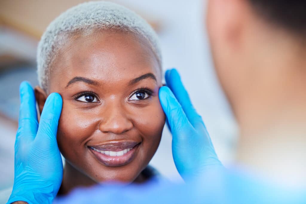 woman-undergoing-facial-examination-by-medical-pro-2026-03-25-05-03-40-utc